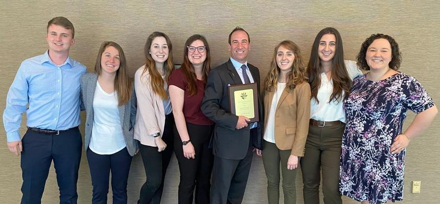 RWU Forensic & Legal Psychology students stand with a faculty member